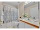Bathroom with tile flooring, shower/tub combo, and vanity with countertop space at 1181 Welch Hill Cir, Apopka, FL 32712