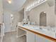 Bright bathroom featuring double sinks, tile floors, and natural light at 1181 Welch Hill Cir, Apopka, FL 32712