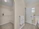 Bathroom with tile flooring and open closet space for ample storage at 1181 Welch Hill Cir, Apopka, FL 32712