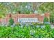 Wekiva Springs Reserve community sign is surrounded by beautiful landscaping and mature trees, giving it a warm, welcoming feel at 1181 Welch Hill Cir, Apopka, FL 32712