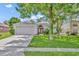 Charming single-story home featuring a well-manicured lawn and a two-car garage in a quiet neighborhood at 1181 Welch Hill Cir, Apopka, FL 32712