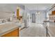 Bright eat-in kitchen features white appliances, tile floors, and arched doorway at 1181 Welch Hill Cir, Apopka, FL 32712