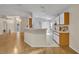 Open concept kitchen adjacent to the living room features a breakfast bar and white appliances at 1181 Welch Hill Cir, Apopka, FL 32712