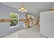 Eat-in kitchen featuring white appliances, light blue walls and tile floors at 1181 Welch Hill Cir, Apopka, FL 32712