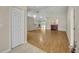 Open concept living room with hardwood floors, fireplace, and plenty of natural light at 1181 Welch Hill Cir, Apopka, FL 32712