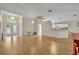 Open-concept living area showcases a chandelier, ceiling fan, and abundant natural light from the front door at 1181 Welch Hill Cir, Apopka, FL 32712