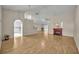 Spacious living room features laminate wood flooring, high ceilings, and an electric fireplace at 1181 Welch Hill Cir, Apopka, FL 32712