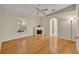 Open living room featuring hard wood floors, an electric fireplace and lots of natural light at 1181 Welch Hill Cir, Apopka, FL 32712