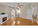 Bedroom featuring hard wood floors, an electric fireplace, ceiling fan and en suite bathroom at 1181 Welch Hill Cir, Apopka, FL 32712