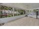 Enclosed sunroom with large windows and tile flooring at 1181 Welch Hill Cir, Apopka, FL 32712