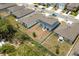 Aerial view of a backyard with a patio and a privacy fence surrounding the property at 1209 Deepwater Cir, Eagle Lake, FL 33839