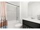 Bathroom with modern fixtures, a bathtub, shower, and a stylish vanity area at 1209 Deepwater Cir, Eagle Lake, FL 33839