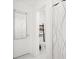 Bathroom with toilet, decorative shelving, decorative shower curtain, and stylish mirror at 1209 Deepwater Cir, Eagle Lake, FL 33839