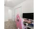 Bedroom with neutral carpet, a computer, and a pink Autofull gaming chair at 1209 Deepwater Cir, Eagle Lake, FL 33839