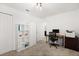 Bedroom featuring neutral carpet, a ceiling light and a white shelf for displaying books or items at 1209 Deepwater Cir, Eagle Lake, FL 33839