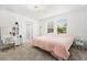 Well-lit bedroom featuring a vanity, ensuite bathroom, and comfortable atmosphere at 1209 Deepwater Cir, Eagle Lake, FL 33839