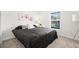 Bright bedroom with a window and comfortable bed, creating a relaxing and inviting space at 1209 Deepwater Cir, Eagle Lake, FL 33839