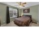 This bedroom features a ceiling fan, carpeted floors, neutral paint, and a window at 1245 Reagans Reserve Blvd, Apopka, FL 32712