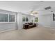 This living room features carpeted floors, neutral paint, a ceiling fan, and a sofa at 1245 Reagans Reserve Blvd, Apopka, FL 32712
