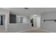 This loft features neutral paint, carpeted floors, and open access to other rooms at 1245 Reagans Reserve Blvd, Apopka, FL 32712