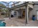 Covered lanai with a view of a large pool area surrounded by brick pavers, screened-in enclosure at 1245 Reagans Reserve Blvd, Apopka, FL 32712