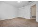 Bedroom featuring a closet with double doors, neutral carpet, and white walls at 12824 Cloverdale Ln, Clermont, FL 34711