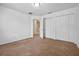 Bedroom with carpeted floors and a closet at 12824 Cloverdale Ln, Clermont, FL 34711