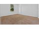 Bright, carpeted bedroom with a window letting in natural light at 12824 Cloverdale Ln, Clermont, FL 34711