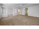 Spacious bonus room featuring carpet, white walls, a ceiling fan, and many archways at 12824 Cloverdale Ln, Clermont, FL 34711