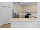 Bright kitchen with stainless steel appliances and spacious countertops at 12824 Cloverdale Ln, Clermont, FL 34711