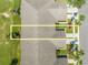 An aerial view showing the proximity of a building to a parking and garden/green space at 130 Club Villas Ln, Kissimmee, FL 34744