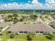 Aerial view showcasing backyard and the community's beautiful lake and lush landscaping at 130 Club Villas Ln, Kissimmee, FL 34744