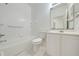 Bathroom equipped with a bathtub, toilet, and vanity with ample storage for a functional space at 130 Club Villas Ln, Kissimmee, FL 34744