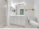 Bathroom featuring a shower, a vanity with storage, and a toilet for everyday convenience at 130 Club Villas Ln, Kissimmee, FL 34744