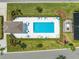 Overhead view of the community pool featuring ample seating, shade and lush landscaping at 130 Club Villas Ln, Kissimmee, FL 34744