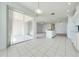 Kitchen with tile floor and sliding door access to the screened porch at 130 Club Villas Ln, Kissimmee, FL 34744