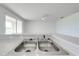 Kitchen sink under a window with the view of the backyard at 130 Club Villas Ln, Kissimmee, FL 34744
