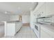 Kitchen with a view to the dining area at 130 Club Villas Ln, Kissimmee, FL 34744