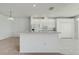 Kitchen area with a breakfast bar and white appliances at 130 Club Villas Ln, Kissimmee, FL 34744
