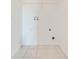 Laundry room with tile flooring and hookups, ready for washer and dryer connections at 130 Club Villas Ln, Kissimmee, FL 34744