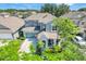 Two-story home in a serene neighborhood with well-maintained lawns and mature trees at 13822 Darchance Rd, Windermere, FL 34786