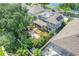 Beautiful home with solar panels, lush landscaping, and a patio area for outdoor enjoyment at 13822 Darchance Rd, Windermere, FL 34786