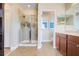 Spacious bathroom with a glass enclosed shower and neutral tile at 13822 Darchance Rd, Windermere, FL 34786