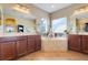 Bright bathroom featuring double vanity, soaking tub and tile flooring at 13822 Darchance Rd, Windermere, FL 34786