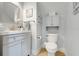 Charming half bath with stylish vanity and storage at 13822 Darchance Rd, Windermere, FL 34786