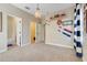 Bright bedroom with nautical decor, large windows, and ensuite bathroom and closet at 13822 Darchance Rd, Windermere, FL 34786