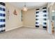Bright bedroom with beach-themed decor and a view to the bathroom at 13822 Darchance Rd, Windermere, FL 34786