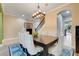 Elegant dining room with stylish chandelier, large table, and views of the staircase at 13822 Darchance Rd, Windermere, FL 34786
