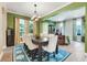 Bright dining room with hardwood floors, a large table, and views into the living spaces at 13822 Darchance Rd, Windermere, FL 34786