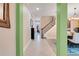 Bright foyer with tile flooring, staircase, and views of the dining room and living spaces at 13822 Darchance Rd, Windermere, FL 34786
